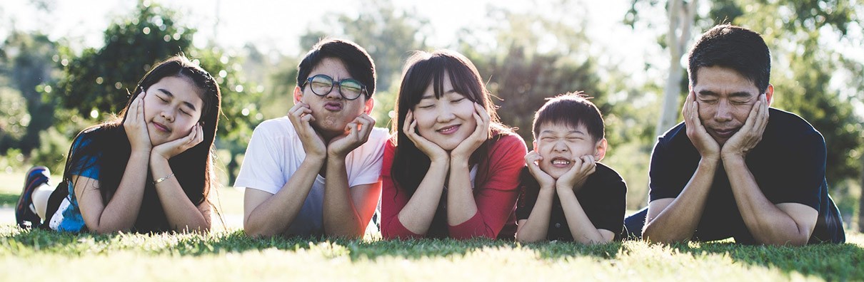 Family Laying in The Grass Family Laying in The Grass